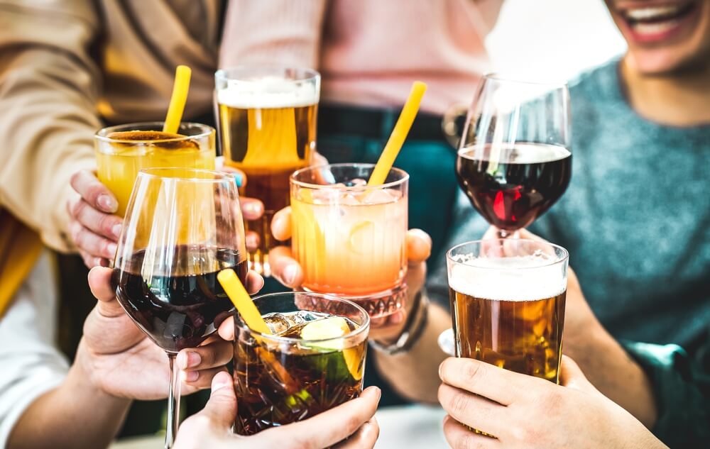 A group of people with drinks at one of the bars in Broken Bow.